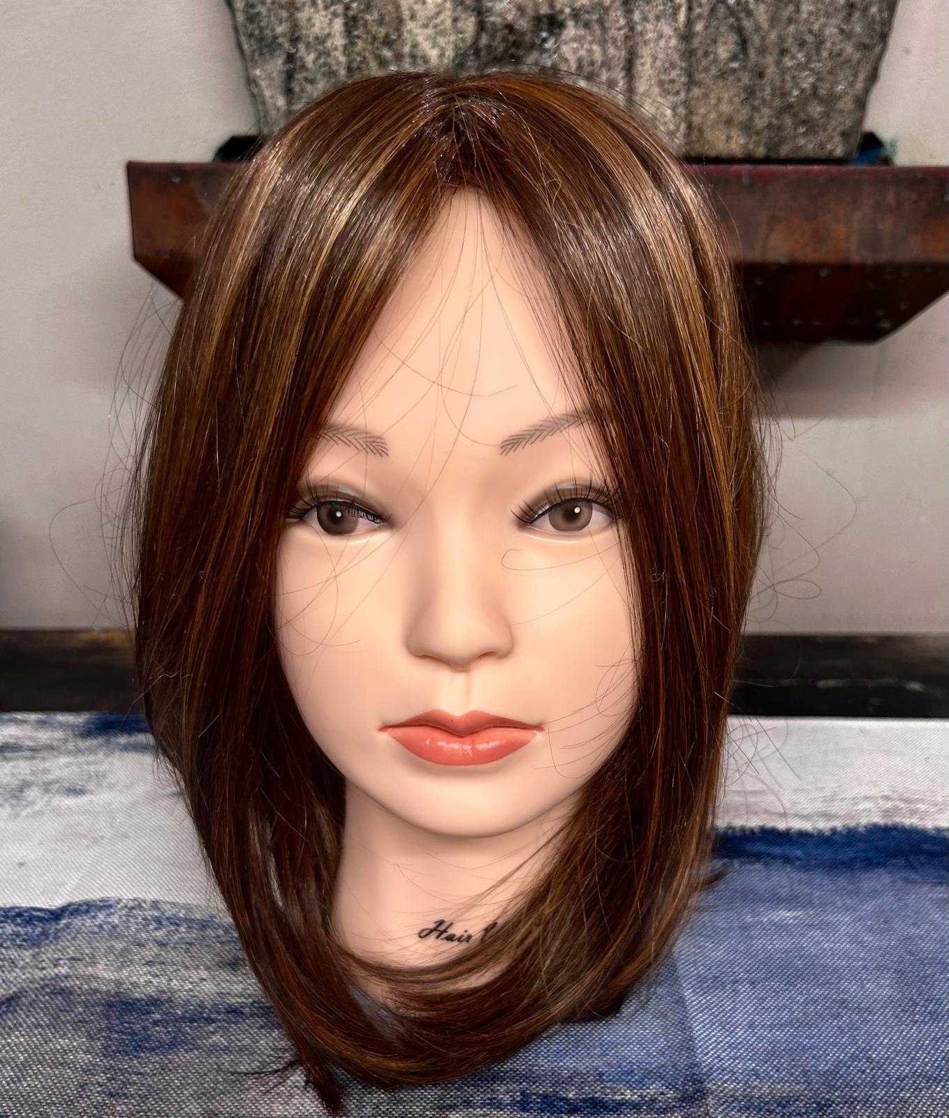 Warm brunette topper with highlights